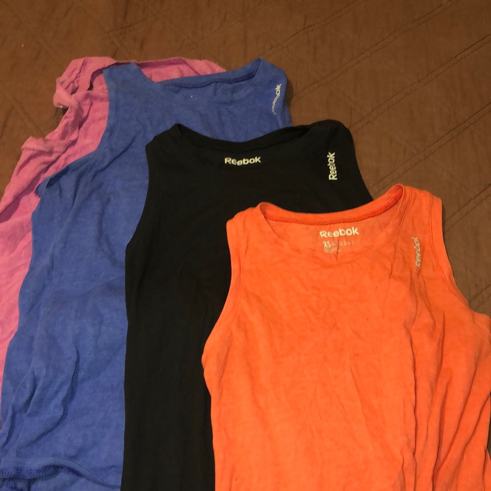 4 pack Reebok tanks